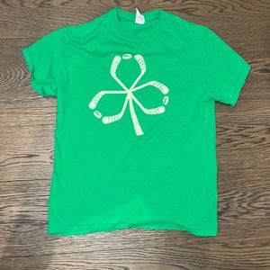 Green clover made of hockey stick shirt